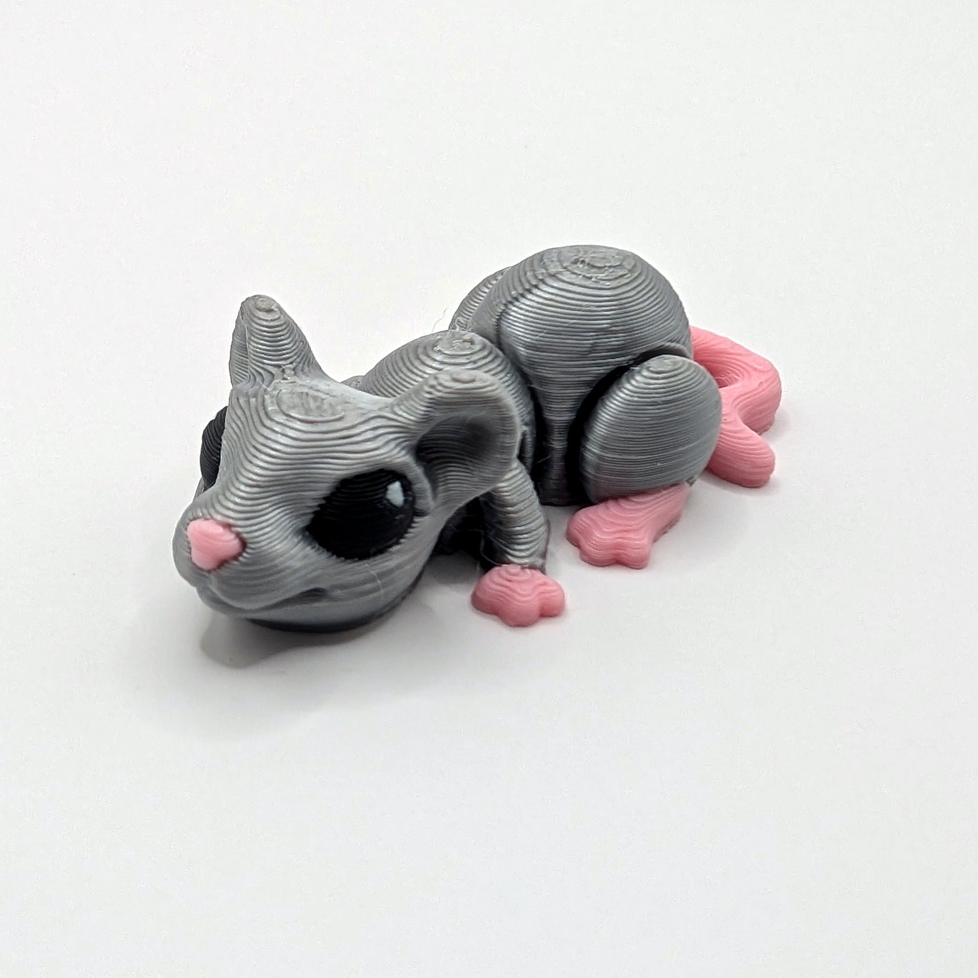 Grey mouse Hatchling articulated 3D-printed fidget companion on a white background