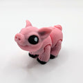 Pink pig Hatchling articulated 3D-printed fidget companion on a white background