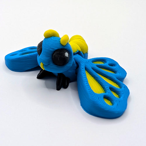 Colourful Butterfly Hatchling articulated 3D-printed fidget companion, wings open