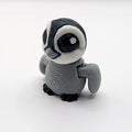 Grey owl Hatchling articulated 3D-printed fidget companion on a white background
