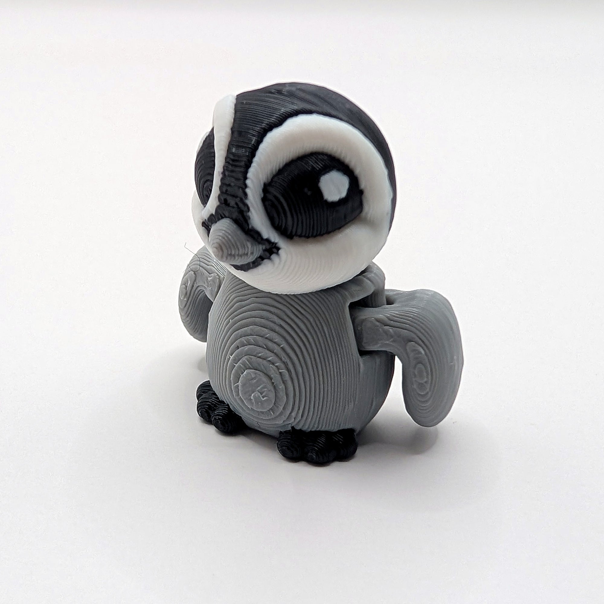 Grey owl Hatchling articulated 3D-printed fidget companion on a white background