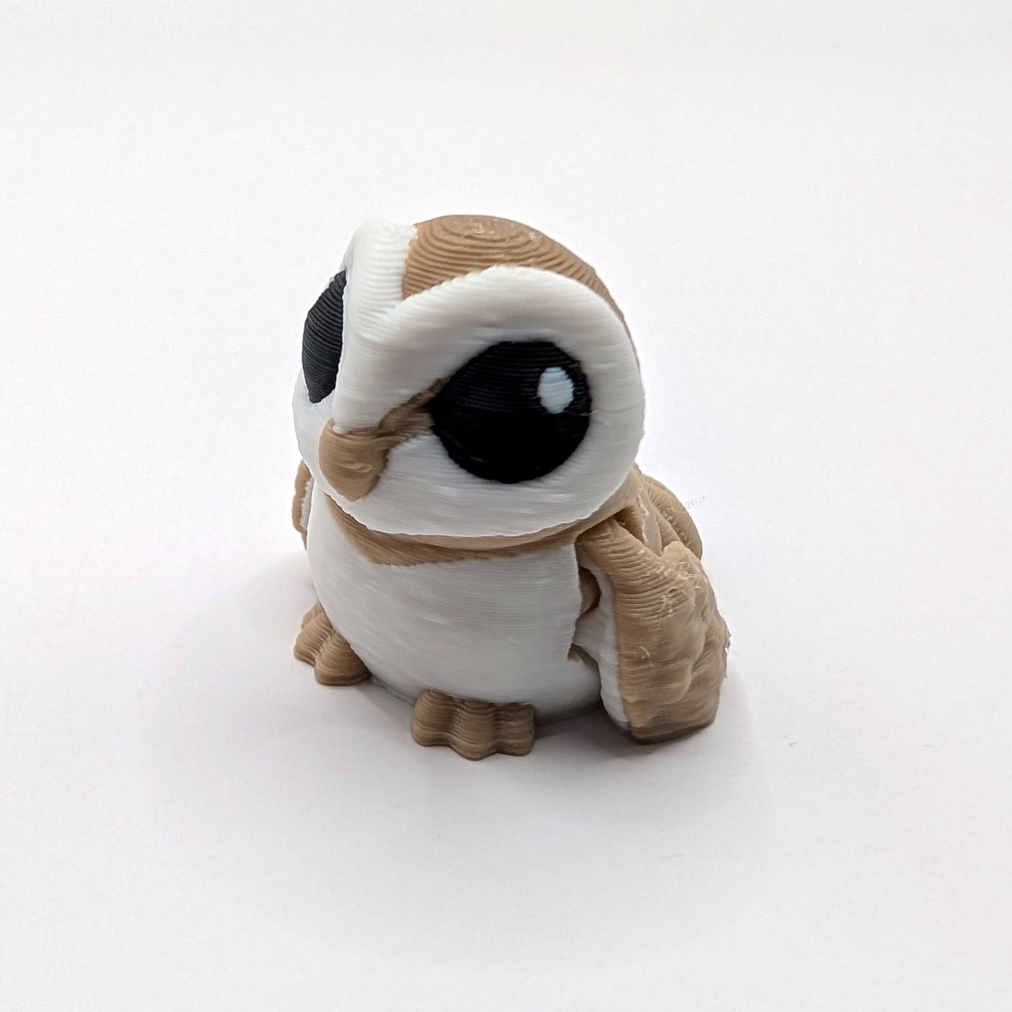 Brown owl Hatchling articulated 3D-printed fidget companion on a white background